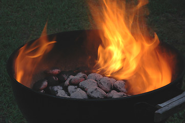 Image showing flaming charcoals