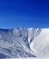 Image showing Off-piste slope with traces of avalanche in sun morning