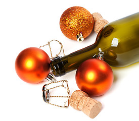 Image showing Empty bottle of wine, corks, muselets and Christmas decorations