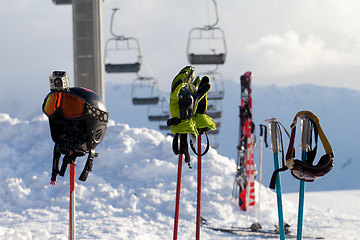 Image showing Protective sports equipment on ski poles at ski resort