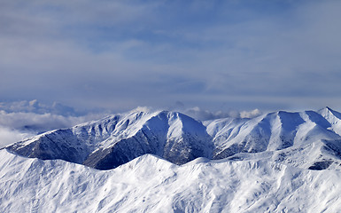 Image showing Winter mountains in clouds at windy day