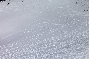 Image showing Off-piste slope with traces of skis and snowboards