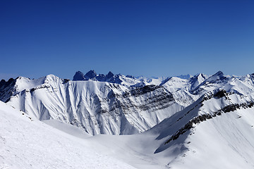 Image showing Off-piste slope in sun day and traces of avalanches, ski and sno