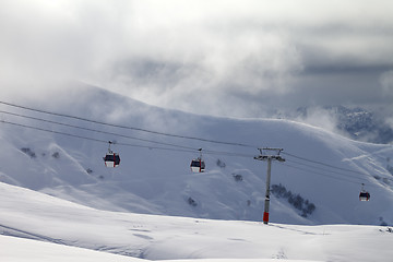 Image showing Gondola lifts and off-piste slope in mist