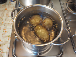 Image showing Saucepot with potatoes on cooker
