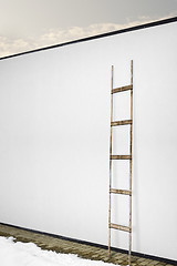 Image showing white wall with a wooden ladder