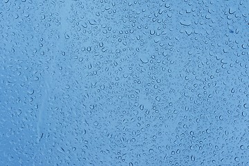 Image showing Natural water drops on glass