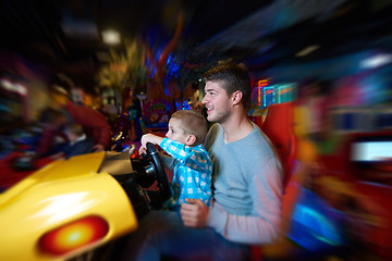 Image showing father and son playing game in playground