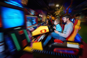 Image showing father and son playing game in playground