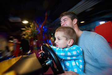 Image showing father and son playing game in playground