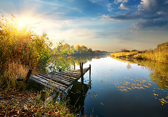 Image showing Old pier on autumn river