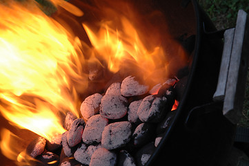 Image showing flaming charcoals in kettle