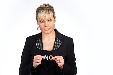 Image showing Studio portrait of a cute blond girl holding two letters forming