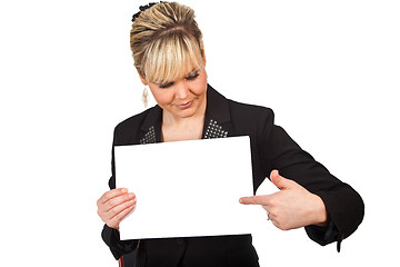 Image showing Studio portrait of a cute blond girl holding a piece of paper