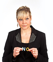 Image showing Studio portrait of a cute blond girl holding two letters forming