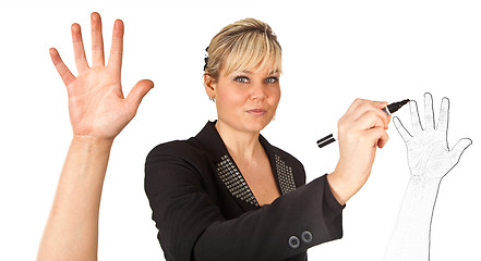 Image showing Studio portrait of a cute blond girl writing on a transparent wa