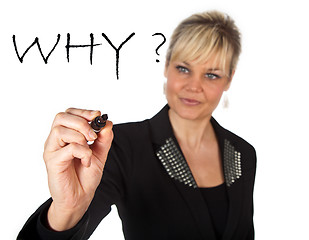 Image showing Studio portrait of a cute blond girl writing on a transparent wa