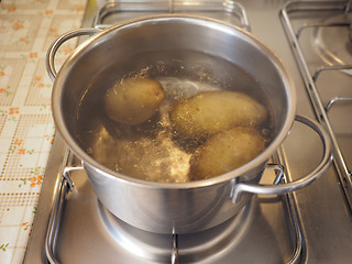 Image showing Saucepot with potatoes on cooker