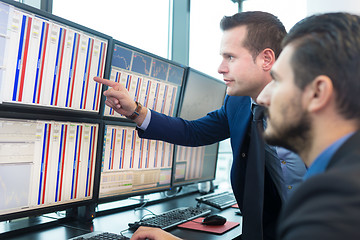 Image showing Stock traders looking at computer screens.