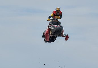 Image showing High jump of sportsman on snowmobile