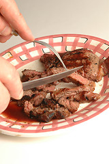 Image showing cutting the steak