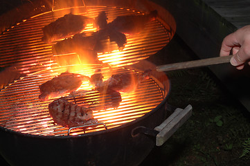 Image showing steaks grilling