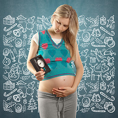 Image showing Pregnant Woman Looking For Christmas Gifts