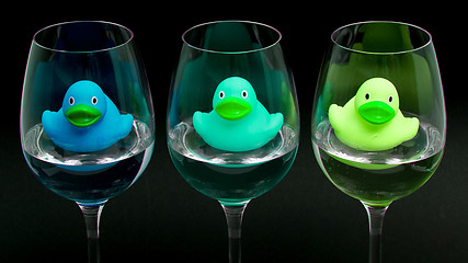 Image showing Blue and green rubber ducks in wineglasses