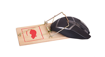 Image showing Modern computer mouse in a mousetrap