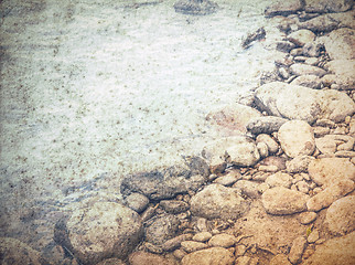 Image showing old grungy water background, stones in a sea