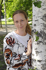 Image showing The woman's portrait in park near a birch.