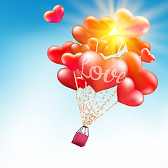 Image showing Couple in hot air hearts balloons. EPS 10