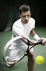 Image showing Young man playing tennis