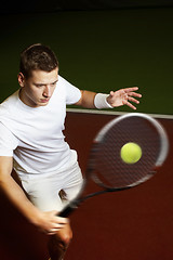 Image showing Young man playing tennis