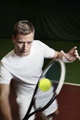 Image showing Young man playing tennis