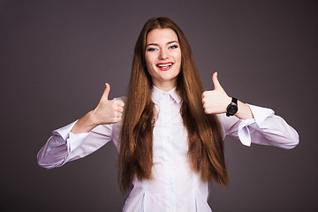 Image showing Woman shows thumb up