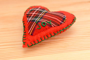 Image showing Hand-stitched festive heart, embroidered with the word JOY