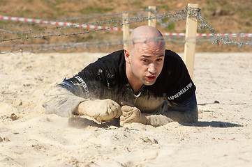 Image showing Man crawling on sand