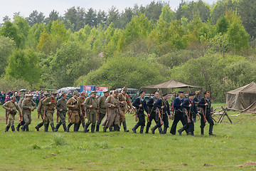 Image showing Hicking squad attack the village