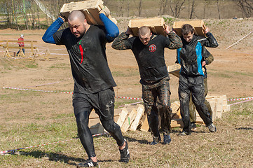 Image showing carrying heavy boxes