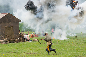 Image showing Village under explosion attack