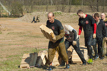 Image showing carrying heavy boxes