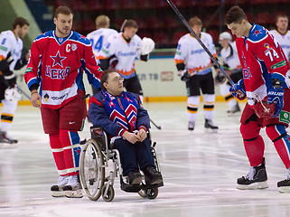 Image showing Disabled fan on wheelchair