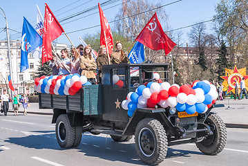 Image showing Truck with girls in uniform of times WW2 on parade