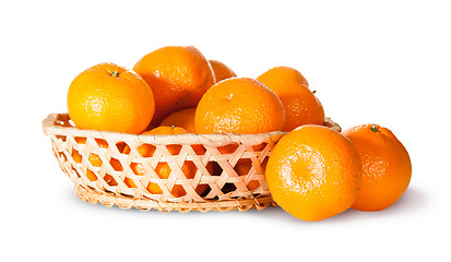 Image showing Ripe Sweet Tangerines In Wicker Basket