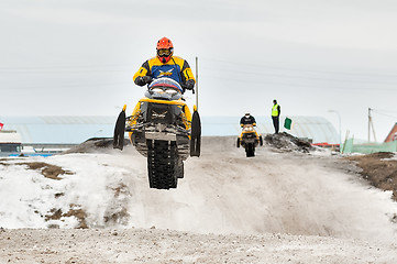 Image showing High jump of sportsman on snowmobile