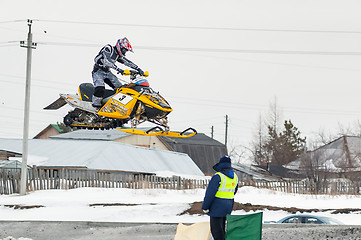 Image showing Jump of sportsman on snowmobile