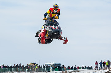 Image showing High jump of sportsman on snowmobile