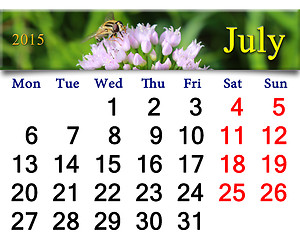 Image showing calendar for July of 2015 with fly on the flower