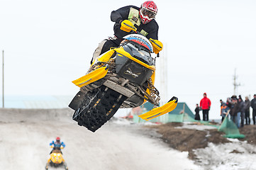 Image showing High jump of sportsman on snowmobile